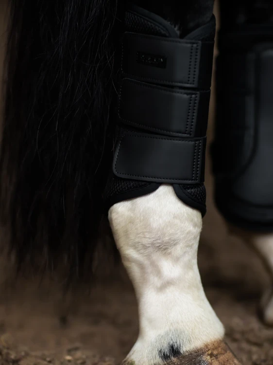 all-black-mesh-brushing-boots.webp